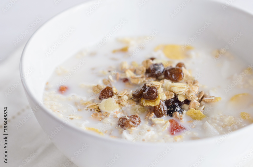 Muesli bowl with mix of unprocessed whole grains, nuts, seeds, fruit and vegan milk. Delicious breakfast meal for energize your day. Heathy food lifestyle. Muesli bowl with mix of unprocessed whole grains, nuts, seeds, fruit and vegan milk. Delicious breakfast meal for energize your day. Heathy food lifestyle.
