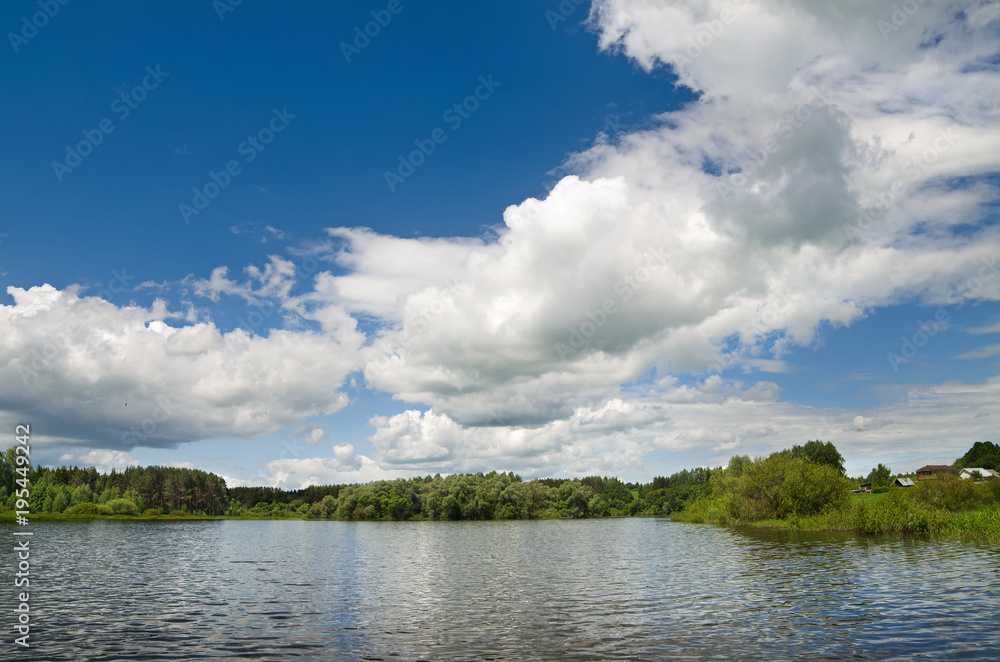 The lake is surrounded by trees along the banks