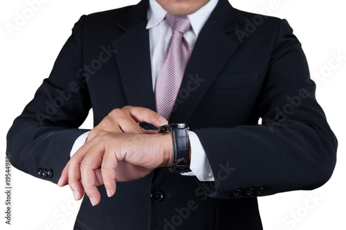 Businessman with wrist watch. © suphakit73