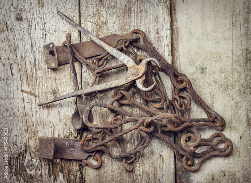 Old vintage rusty tools on a wooden surface