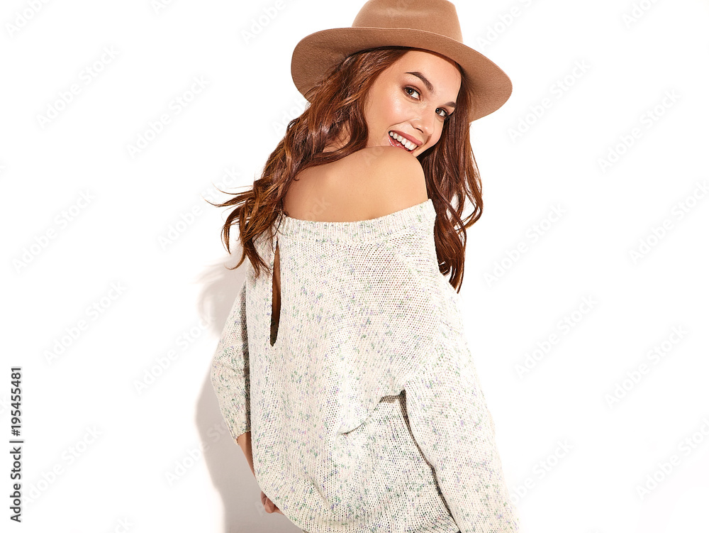 Portrait of young stylish girl model in casual summer clothes in brown hat with natural makeup isolated on white background. Looking at camera