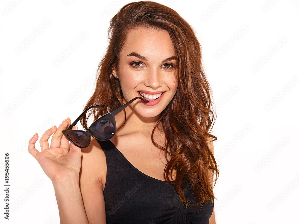 Portrait of young stylish girl model in casual summer clothes with natural makeup in sunglasses isolated on white background Portrait of young stylish girl model in casual summer clothes with natural makeup in sunglasses isolated on white background