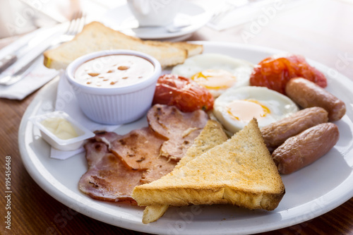 Egg and Toast - classical english breakfast with egg and ham