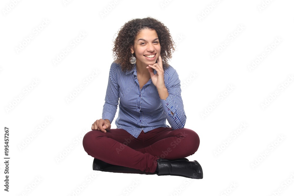 Afro woman sitting on the floor