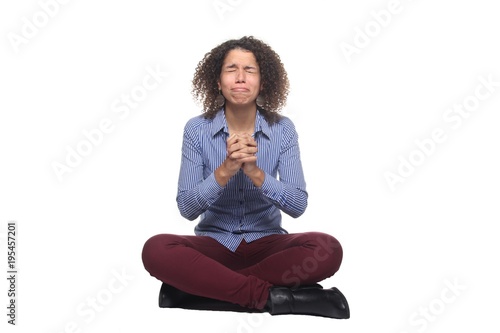 Afro woman sitting on the floor