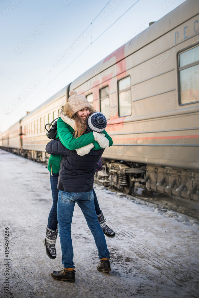 Couple meet each other after long time at railway station near train Couple meet each other after long time at railway station near train