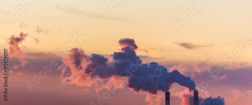 Smoking pipes of thermal power on sunrise photo