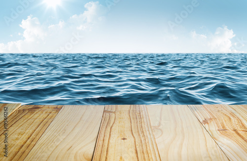 Blue sea and clear sky with wooden table 