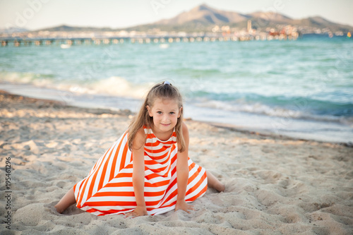 Cute girl on a beach on sunset. Mallorca, Spain