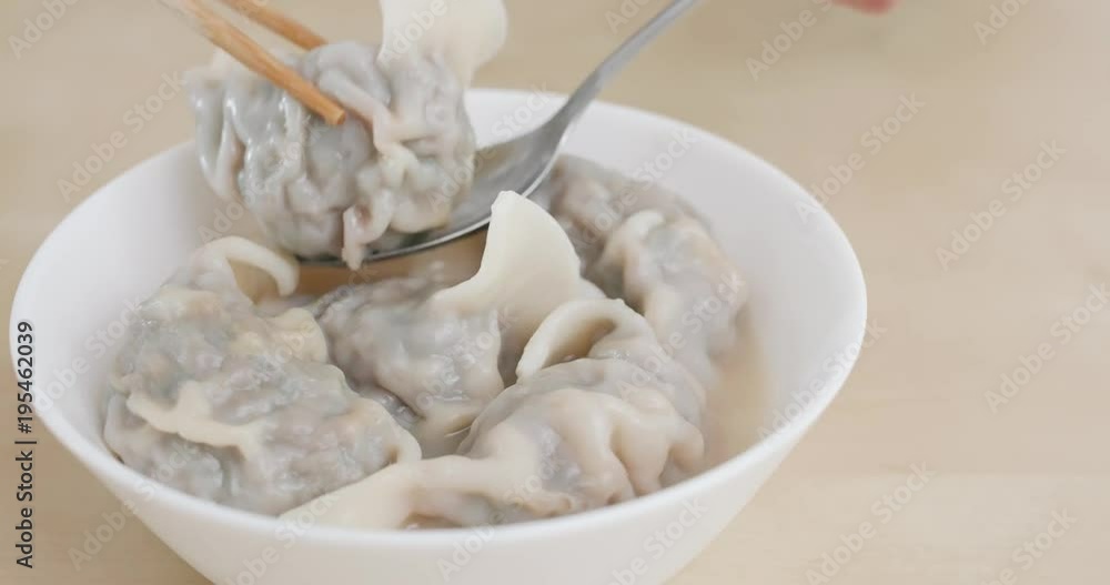 Eating chinese soup meat dumpling Eating chinese soup meat dumpling