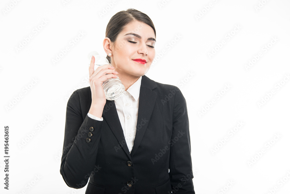 Beautiful stewardess chilling herself with bottle of water Beautiful stewardess chilling herself with bottle of water