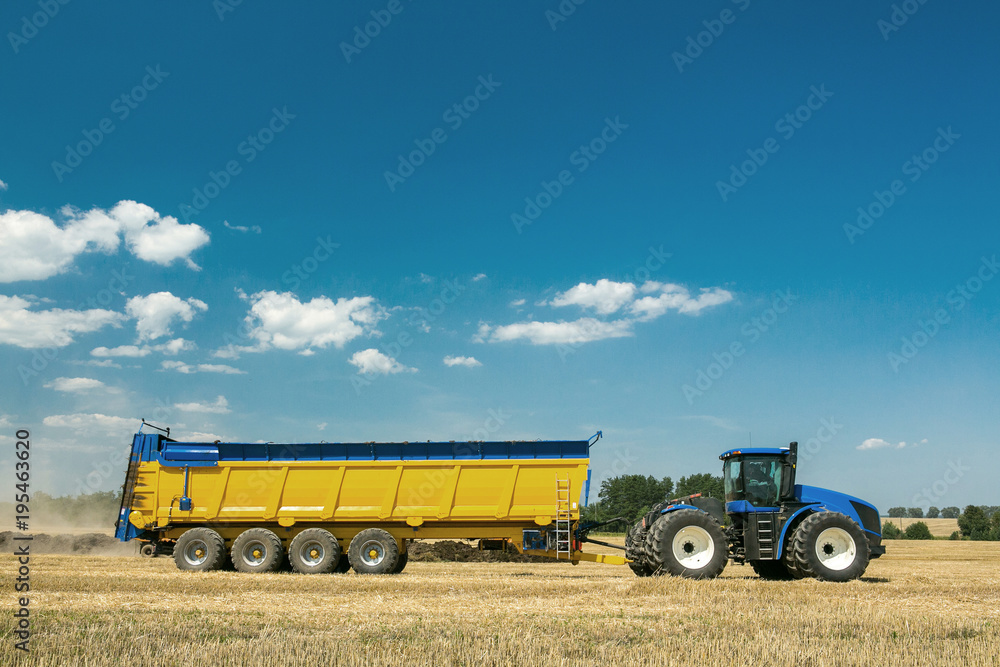 Obraz premium agricultural machinery in the foreground, performing work on the ground.