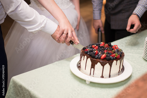 Chocolate cake with berries on a white plate