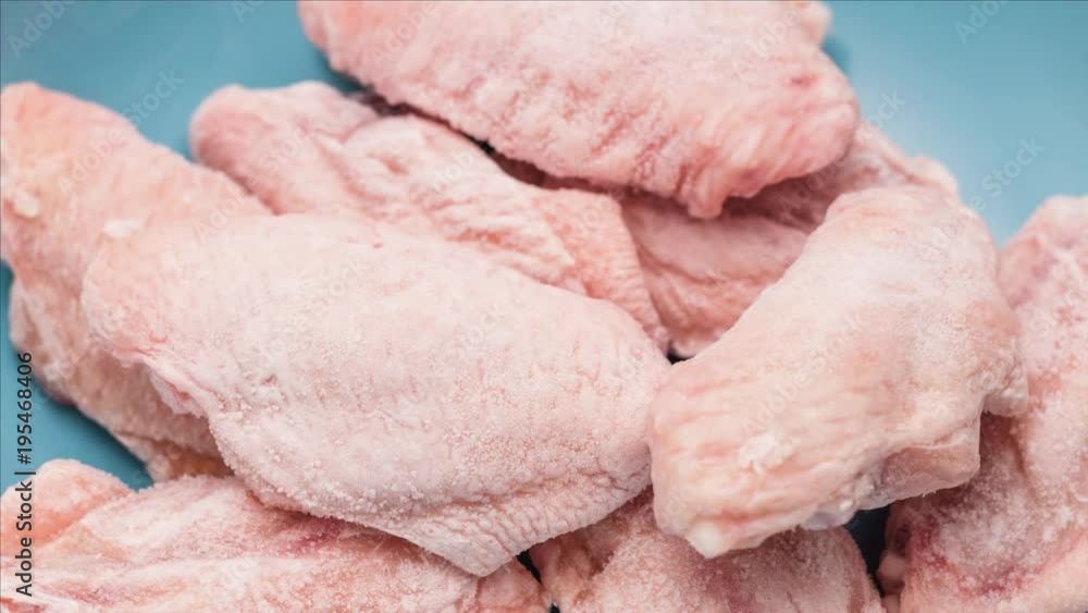 Timelapse process of unfreezing packing of chicken wing Timelapse process of unfreezing packing of chicken wing