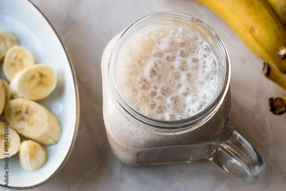 Milky Banana Smoothie in Mason Jar with Milk (Milkshake) Milky Banana Smoothie in Mason Jar with Milk (Milkshake)