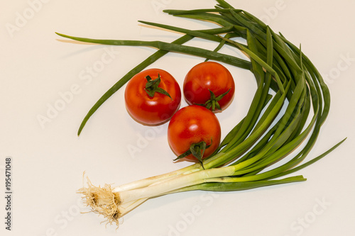 Tomatoes and onions isolated on white background