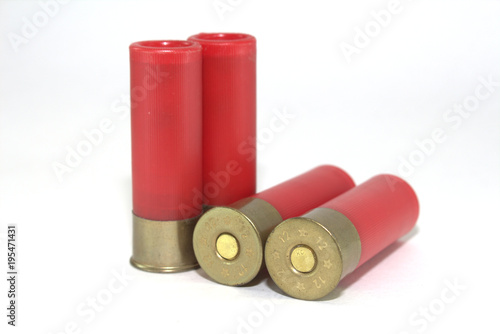 Four old cartridges for shotgun on white background close-up