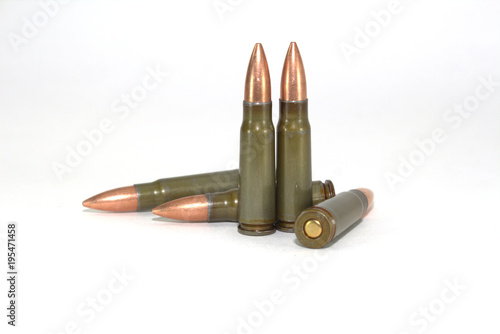 Five rounds for a Kalashnikov rifle machine on a white background close-up