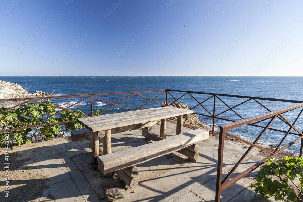 Mediterranean view, balcony over sea wooden table, Banyuls sur mer,France.
