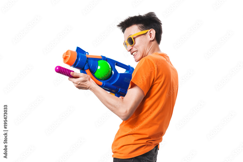 Young man holding water gun on white background. Photos Adobe Stock