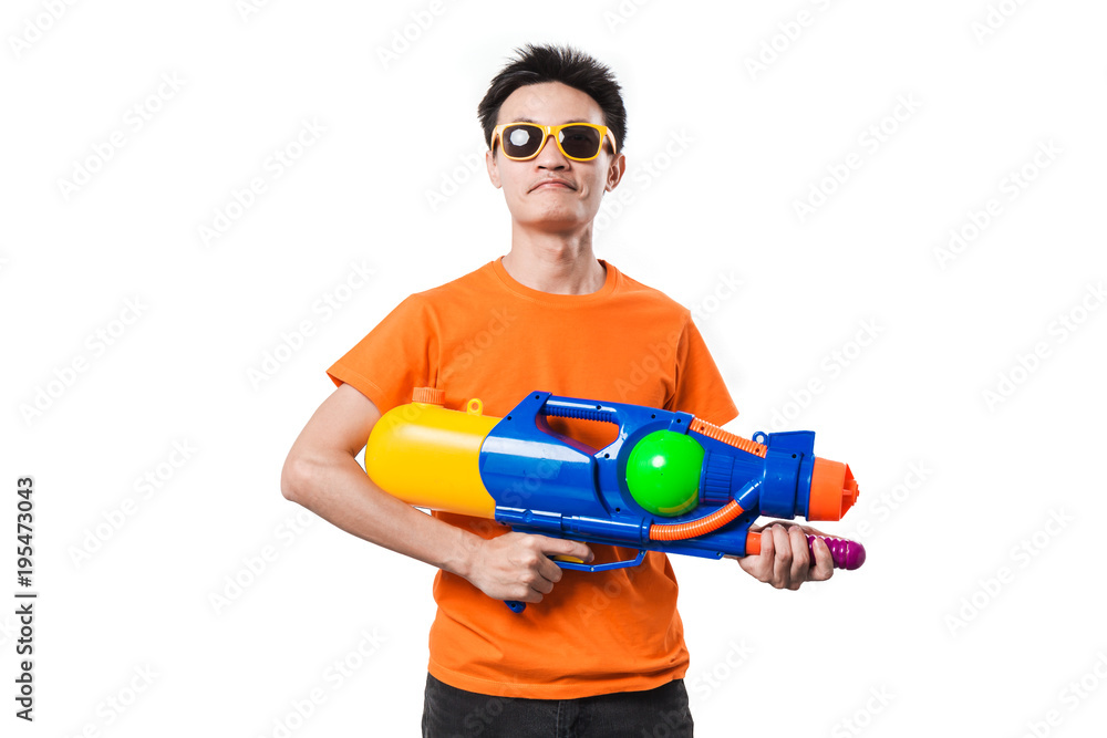 Young man holding water gun on white background. Stock Photo Adobe Stock