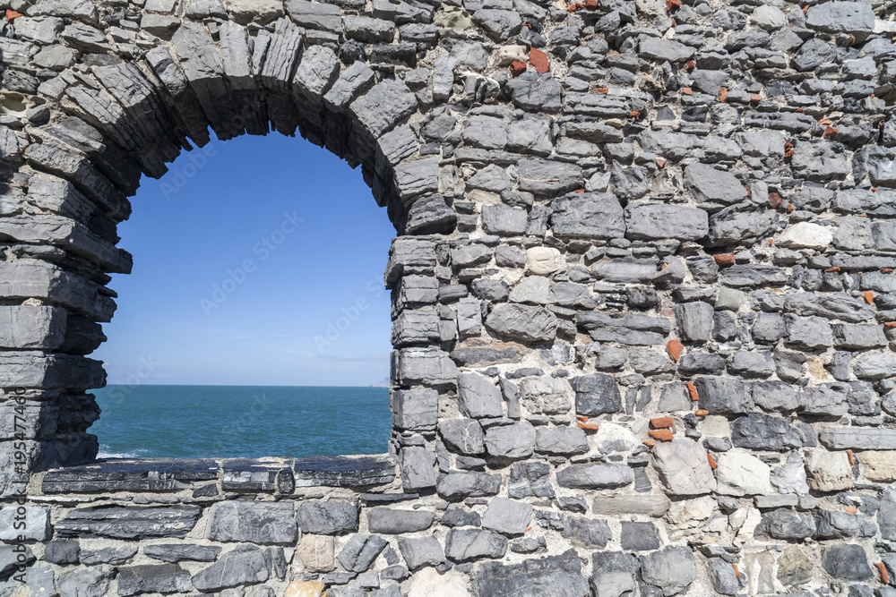 Lord Byron grotto, ancient stone walls,window and mediterranean view,Portovenere, Italy.