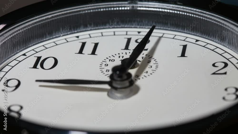 Closeup on slowly rotating clock face with fast moving clock hands - time running out concept, timelapse Closeup on slowly rotating clock face with fast moving clock hands - time running out concept, timelapse