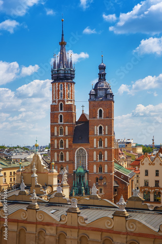 .View of the mariacki church and the roof of the building sukiennice from the height of the town hall building in the Polish city of Krakow. photo