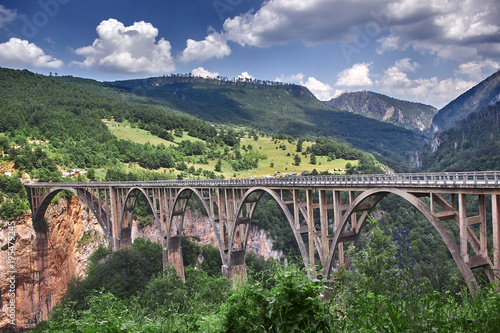 Old big bridge in Durdevica and fantastic view Tara river gorge - is the biggest one canyon in Europe in the national park Durmitor, Montenegro. Balkans.