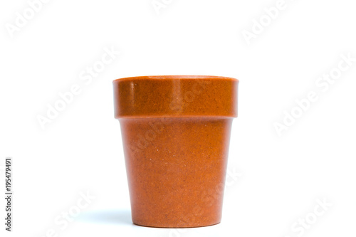 Recycled materials biodegradable tree pot isolated on a white background
