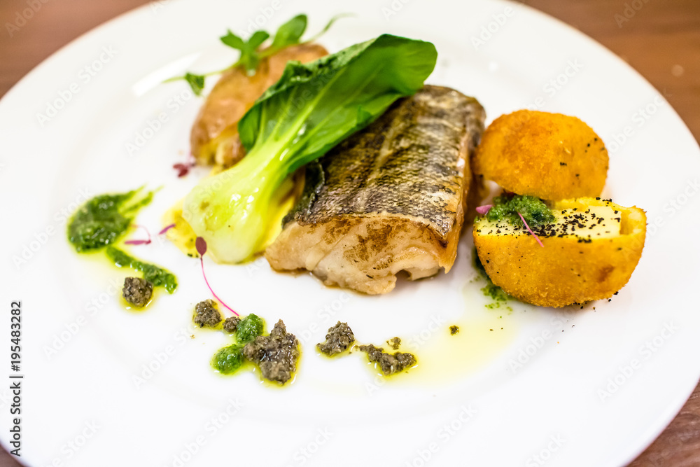 Fish baked with salad and potato croquettes. Fish baked with salad and potato croquettes.