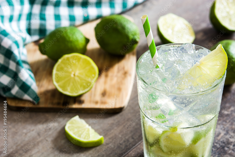 Fototapeta premium Caipirinha cocktail in glass on wooden table background.
