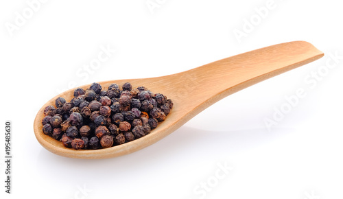 black pepper seeds in wooden spoon
