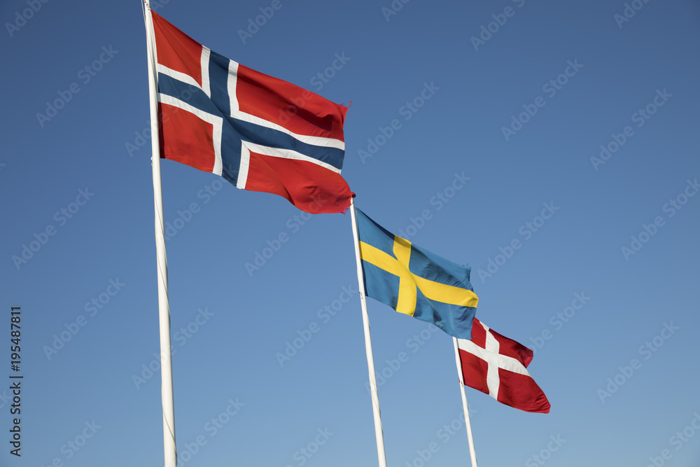 Scandinavian country flags against blue sky, Hornbaek, Kattegat Coast, Zealand, Denmark