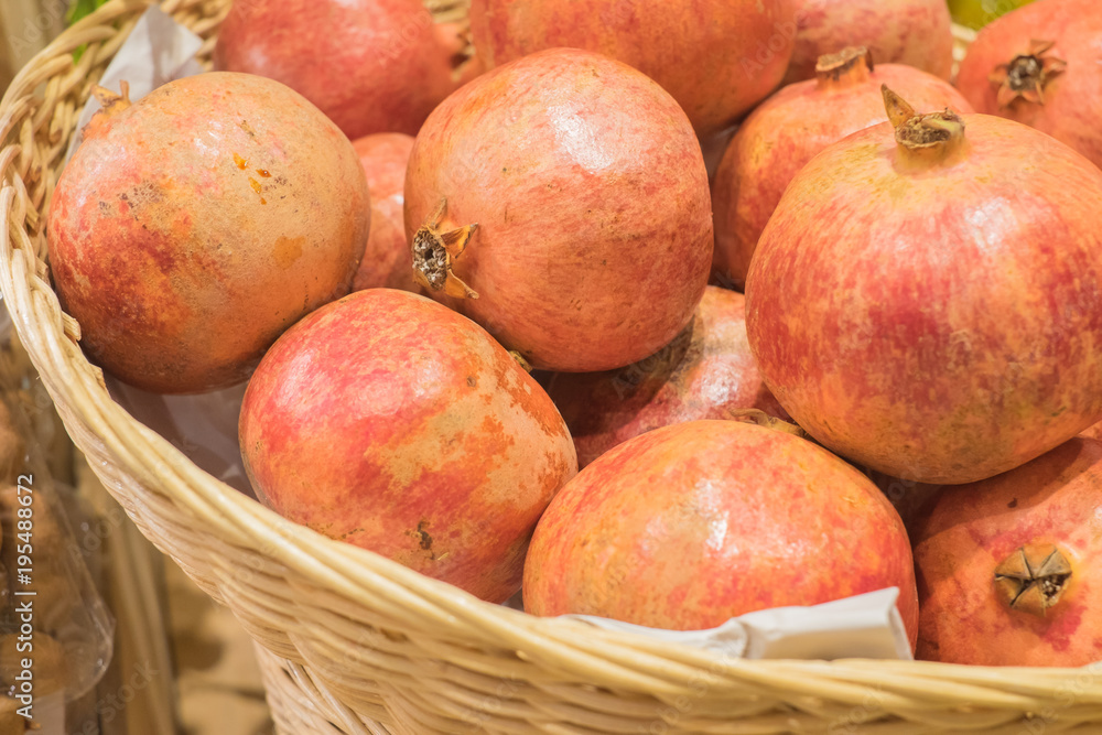Pomegranate fruit in the basket . Healthy eating concept. Pomegranate fruit in the basket . Healthy eating concept.