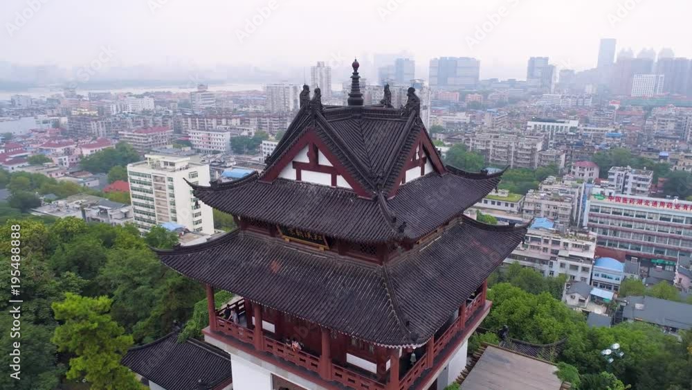 WUHAN, CHINA - MAY 2, 2017: red gate bell temple park day yellow crane aerial drone view panorama WUHAN, CHINA - MAY 2, 2017: red gate bell temple park day yellow crane aerial drone view panorama