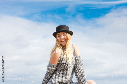 Woman wearing fedora and jumper outdoor