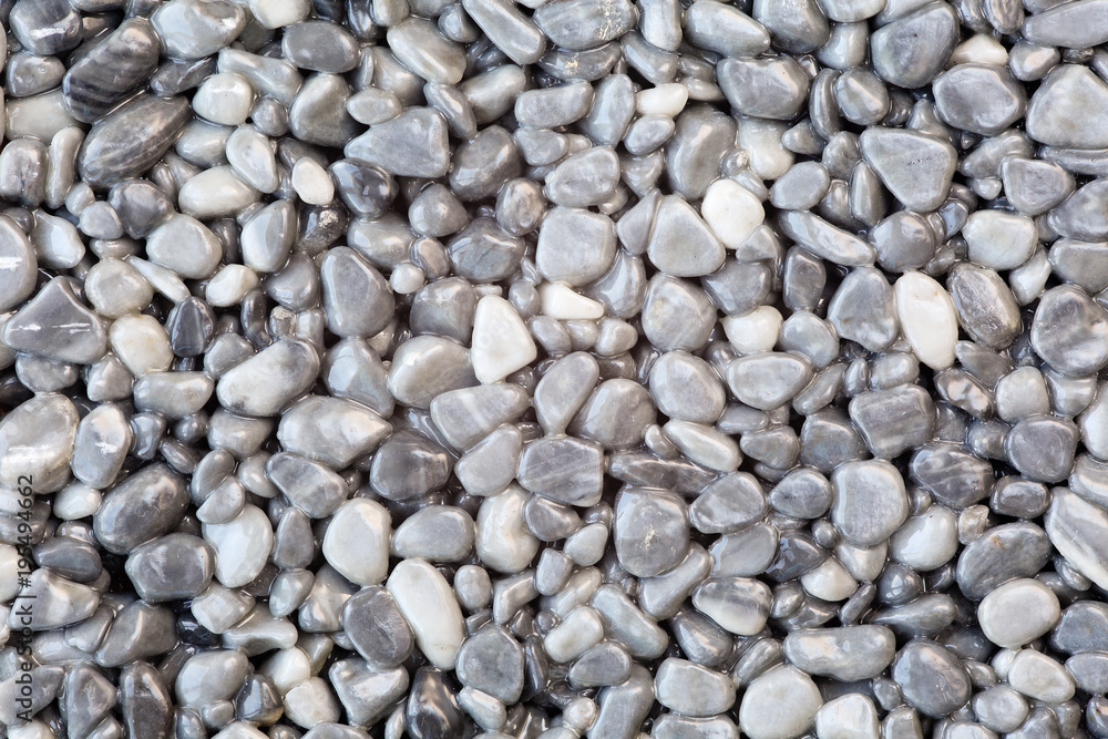 Close up of a natural stone carpet. Decorative stone coating. Slip resistant floor finish containing natural stone particles Close up of a natural stone carpet. Decorative stone coating. Slip resistant floor finish containing natural stone particles