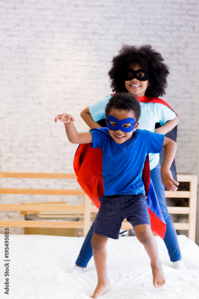 African American happy and confident young kids playing . and dressing