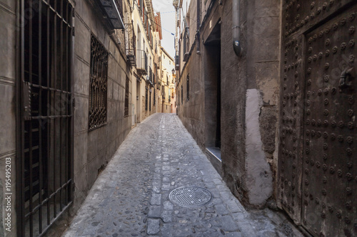 Narrow street in historic center of Toledo. Spain.
