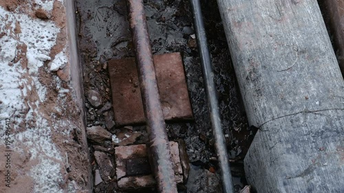 Wallpaper Mural Crash, burst pipes and leaking water under the earth. Excavated pipes in the winter. Torontodigital.ca