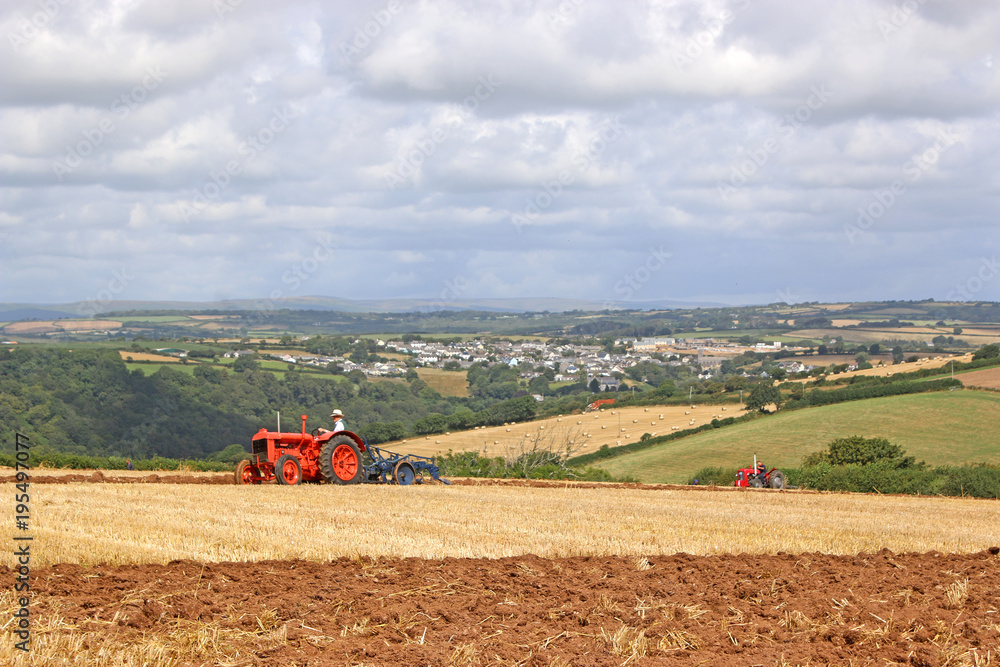 Fototapeta premium Vintage tractor ploughing