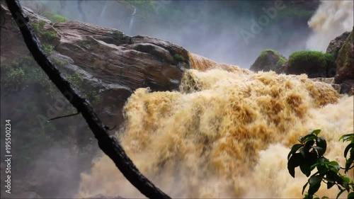 Landscape of huge water flows leaving the waterfall in the background.