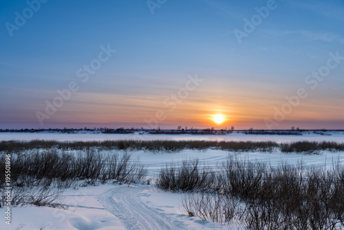 The setting sun on a frosty evening © Dobrydnev