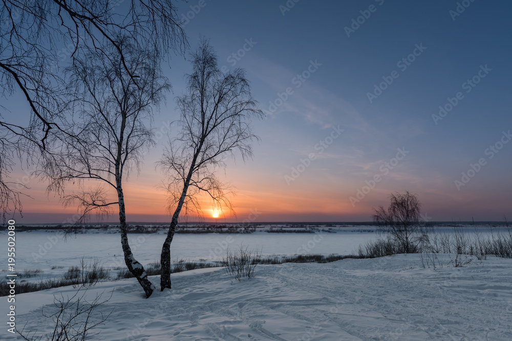 The setting sun on a frosty evening The setting sun on a frosty evening