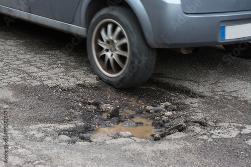 Big pothole caused by freezing and rain in Rome, Italy photo