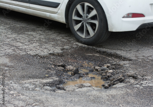 Big pothole caused by freezing and rain in Rome, Italy