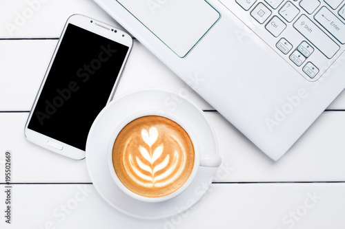 phone coffee laptop view from above wooden white background