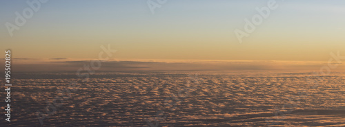 sunset horizon viewed from airplane window 