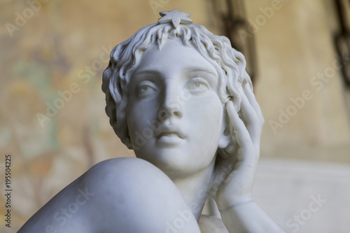 Marble sculpture of beautiful woman in a greek style